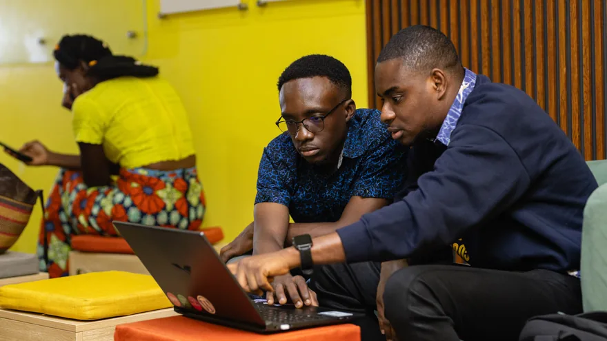 Two founders working through a problem together.
